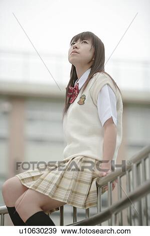 High school girl sitting on railing View Large Photo Image Stock Photo - High school girl sitting on railing. Fotosearch