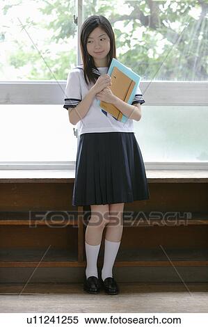 Stock Photography - High school girl standing. Fotosearch