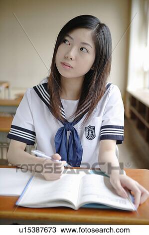 Stock Image - High school girl studying. Fotosearch