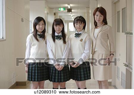 Three high school girls and female teacher standing View Large Photo Image Stock Image - Three high school girls and female teacher standing. Fotosearch