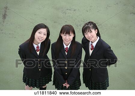 Stock Image - Three high school girls smiling. Fotosearch