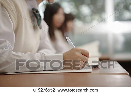 Stock Image - Three high school girls studying. Fotosearch