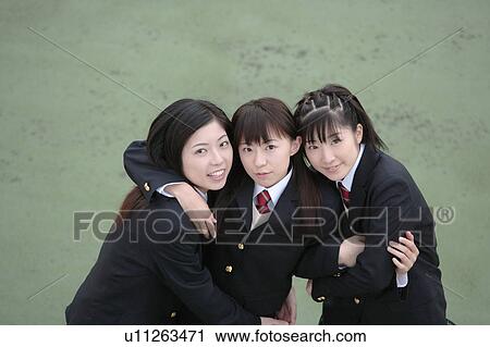 Three high school girls with arms around each other smiling View Large Photo Image Stock Image - Three high school girls with arms around each other smiling. Fotosearch