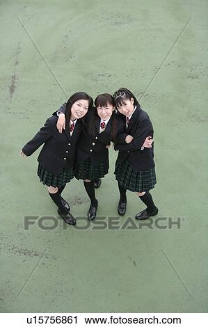 Three high school girls with arms around each other smiling View Large Photo Image Stock Image - Three high school girls with arms around each other smiling. Fotosearch