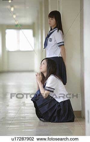 Two high school girls in school corridor View Large Photo Image Stock Image - Two high school girls in school corridor. Fotosearch