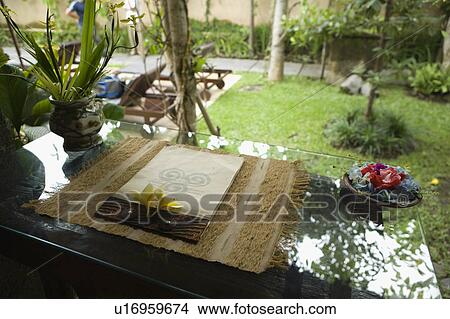 Glass table in courtyard View Large Photo Image Picture - Glass table in courtyard. Fotosearch