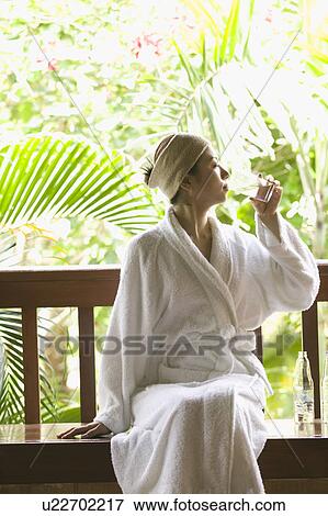 Stock Photo - Young woman drinking glass of water. Fotosearch