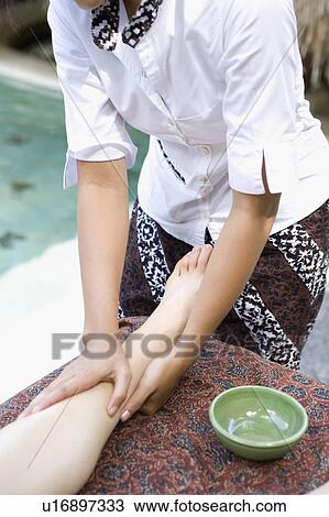 Young woman having leg massage View Large Photo Image Stock Image - Young woman having leg massage. Fotosearch