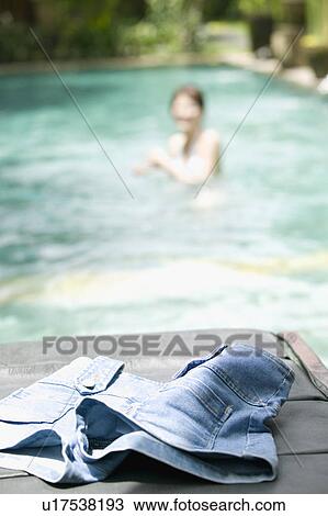 Denim shorts on deck chair View Large Photo Image Stock Image - Denim shorts on deck chair. Fotosearch