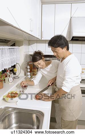 Picture - Mature couple cooking. Fotosearch