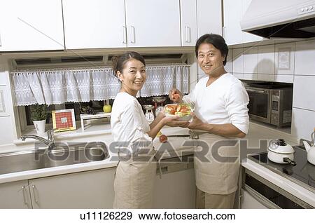 Mature couple cooking View Large Photo Image Stock Photo - Mature couple cooking. Fotosearch