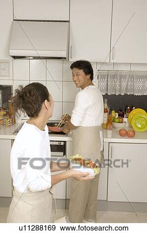 Mature couple cooking View Large Photo Image Stock Photo - Mature couple cooking. Fotosearch
