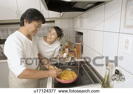 Mature couple cooking View Large Photo Image Stock Photo - Mature couple cooking. Fotosearch