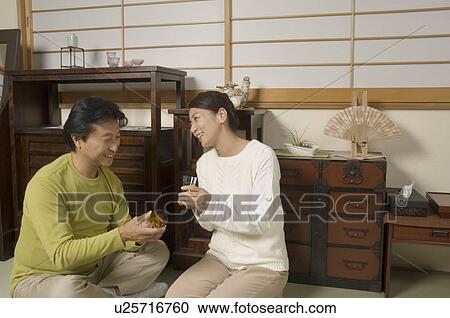 Mature couple drinking together View Large Photo Image Stock Image - Mature couple drinking together. Fotosearch