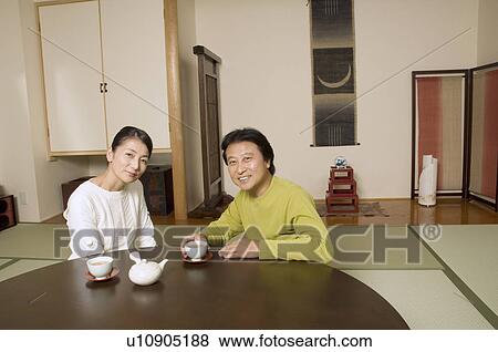 Mature couple having tea View Large Photo Image Stock Photo - Mature couple having tea. Fotosearch