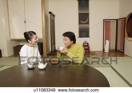 Stock Photo - Mature couple having tea. Fotosearch