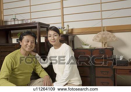 Mature couple looking at camera View Large Photo Image Stock Photo - Mature couple looking at camera. Fotosearch