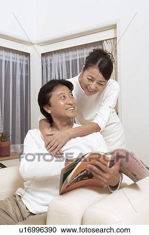 Mature couple reading magazine View Large Photo Image Stock Image - Mature couple reading magazine. Fotosearch