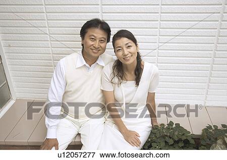 Stock Photo - Mature couple sitting outside. Fotosearch