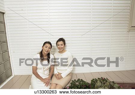 Stock Image - Mature women sitting outside. Fotosearch