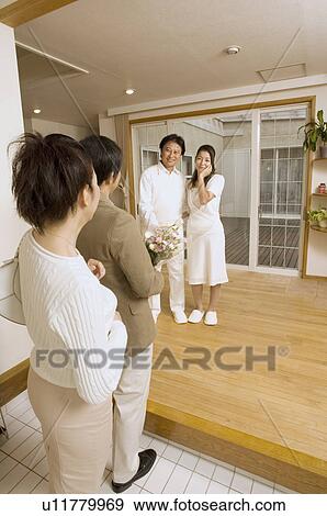 Two mature couples greeting View Large Photo Image Stock Photo - Two mature couples greeting . Fotosearch