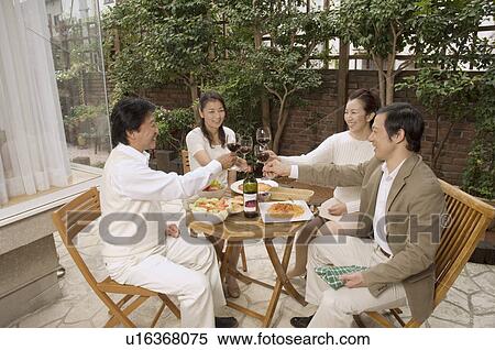 Two mature couples raising glasses View Large Photo Image Stock Photography - Two mature couples raising glasses. Fotosearch