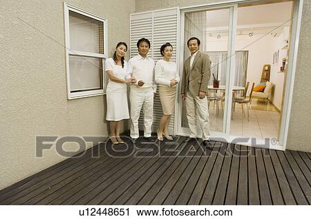 Two mature couples standing on deck View Large Photo Image Stock Image - Two mature couples standing on deck. Fotosearch