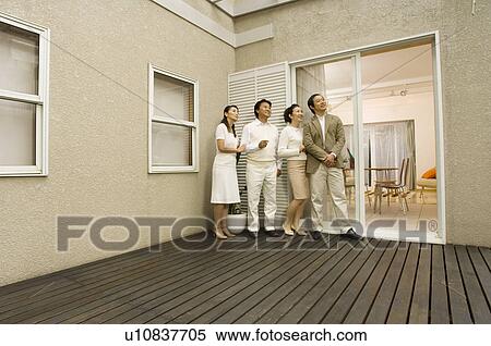 Two mature couples standing on deck View Large Photo Image Stock Photography - Two mature couples standing on deck. Fotosearch