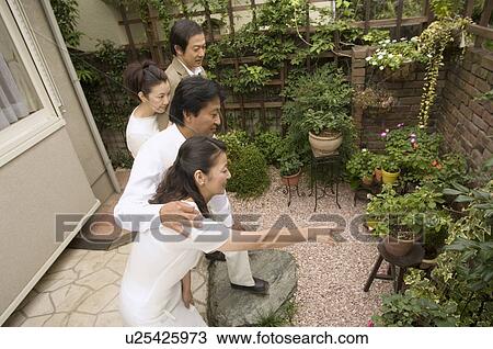 Two mature couples standing outside View Large Photo Image Stock Image - Two mature couples standing outside. Fotosearch