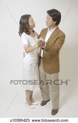 Mature couple dancing together View Large Photo Image Stock Image - Mature couple dancing together. Fotosearch