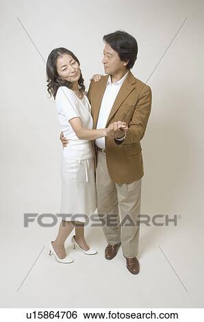 Stock Photograph - Mature couple dancing together. Fotosearch