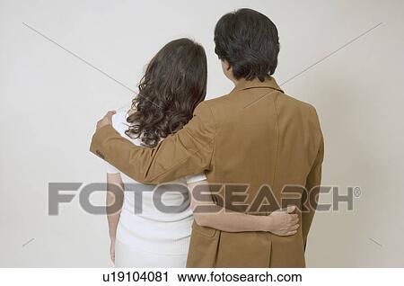 Stock Image - Mature couple holding each other. Fotosearch