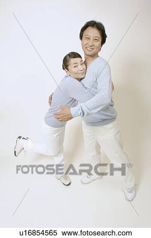 Stock Photography - Mature couple holding each other. Fotosearch