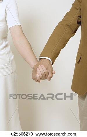 Mature couple holding hands View Large Photo Image Stock Image - Mature couple holding hands. Fotosearch