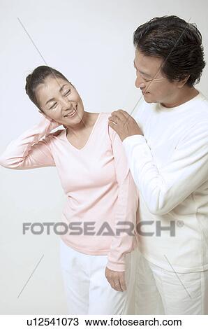 Mature couple standing View Large Photo Image Stock Image - Mature couple standing. Fotosearch