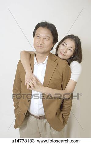 Mature couple standing View Large Photo Image Stock Image - Mature couple standing. Fotosearch