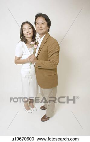 Mature couple standing View Large Photo Image Stock Image - Mature couple standing. Fotosearch