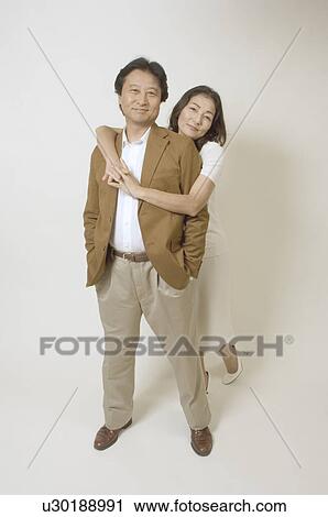 Stock Image - Mature couple standing. Fotosearch