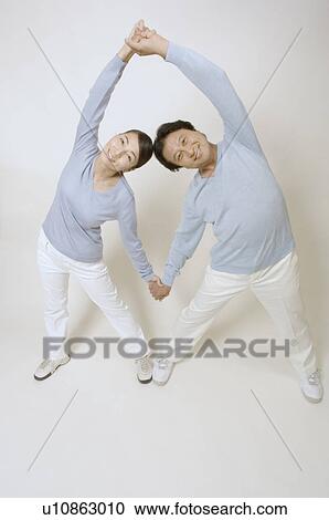 Mature couple stretching View Large Photo Image Stock Image - Mature couple stretching. Fotosearch