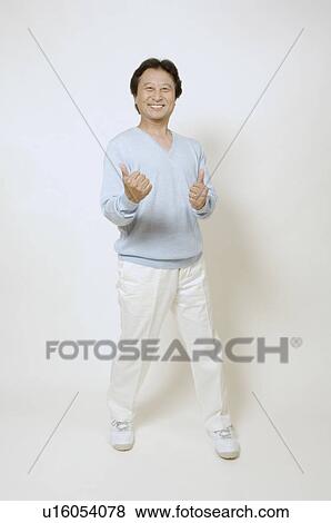 Mature man giving thumbs up View Large Photo Image Stock Photo - Mature man giving thumbs up. Fotosearch