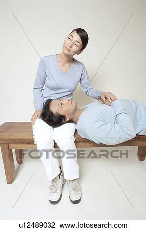 Mature man lying in mature woman's lap View Large Photo Image Stock Image - Mature man lying in mature woman's lap. Fotosearch