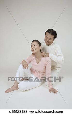 Mature man massaging mature woman's neck View Large Photo Image Stock Photo - Mature man massaging mature woman's neck. Fotosearch