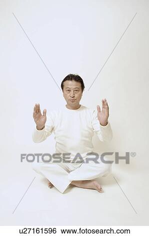 Mature man sitting on floor View Large Photo Image Stock Photograph - Mature man sitting on floor. Fotosearch