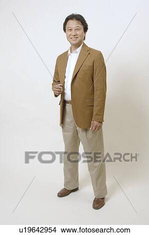 Mature man standing View Large Photo Image Picture - Mature man standing. Fotosearch