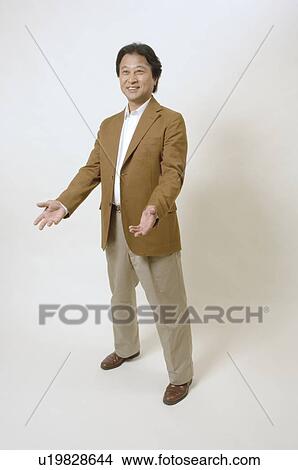 Mature man standing with open arms View Large Photo Image Picture - Mature man standing with open arms. Fotosearch