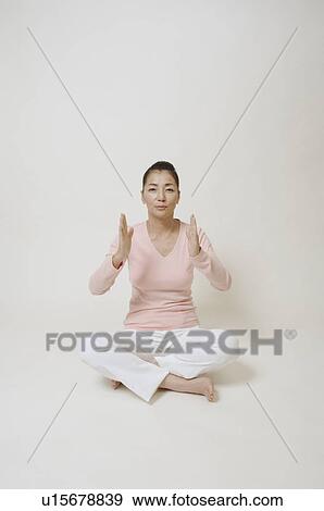 Mature woman sitting on floor View Large Photo Image Stock Photo - Mature woman sitting on floor. Fotosearch
