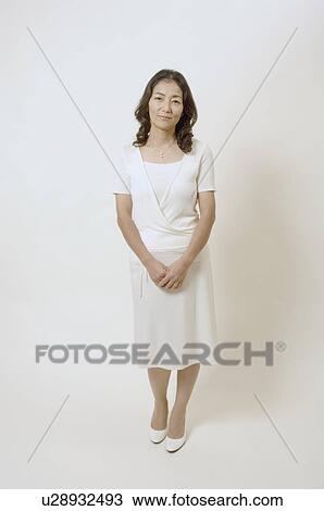 Mature woman standing View Large Photo Image Stock Image - Mature woman standing. Fotosearch