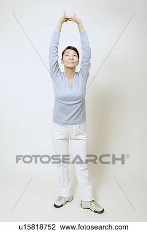 Mature woman stretching View Large Photo Image Stock Image - Mature woman stretching. Fotosearch