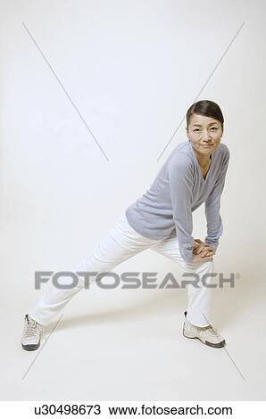 Mature woman stretching View Large Photo Image Stock Image - Mature woman stretching. Fotosearch