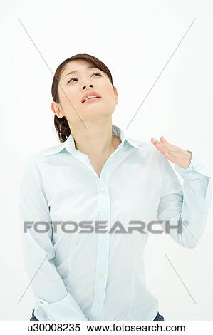 Young woman fanning herself with hand View Large Photo Image Stock Photography - Young woman fanning herself with hand. Fotosearch